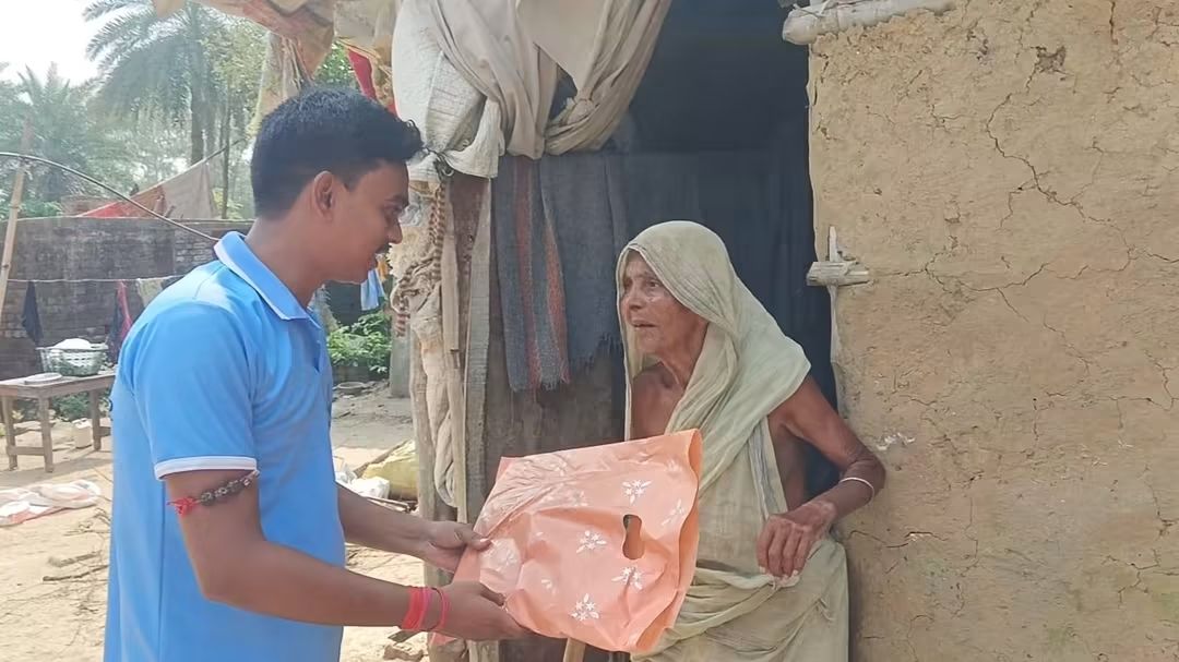 Elderly woman receiving new clothes