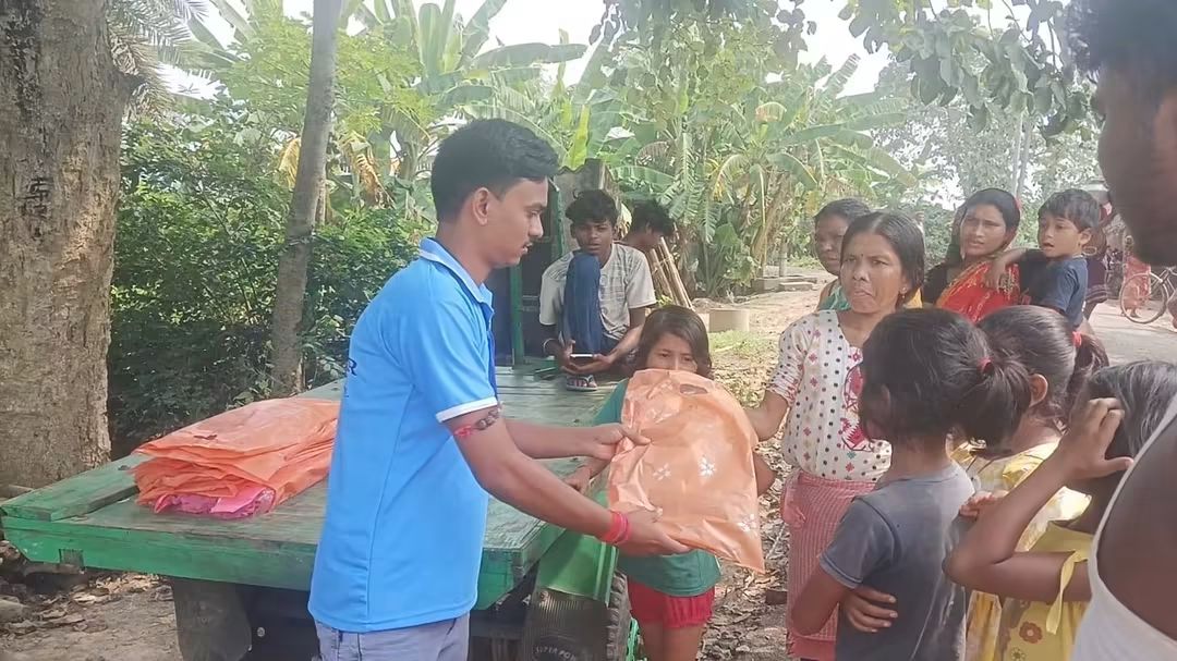 Children gathered during clothes distribution