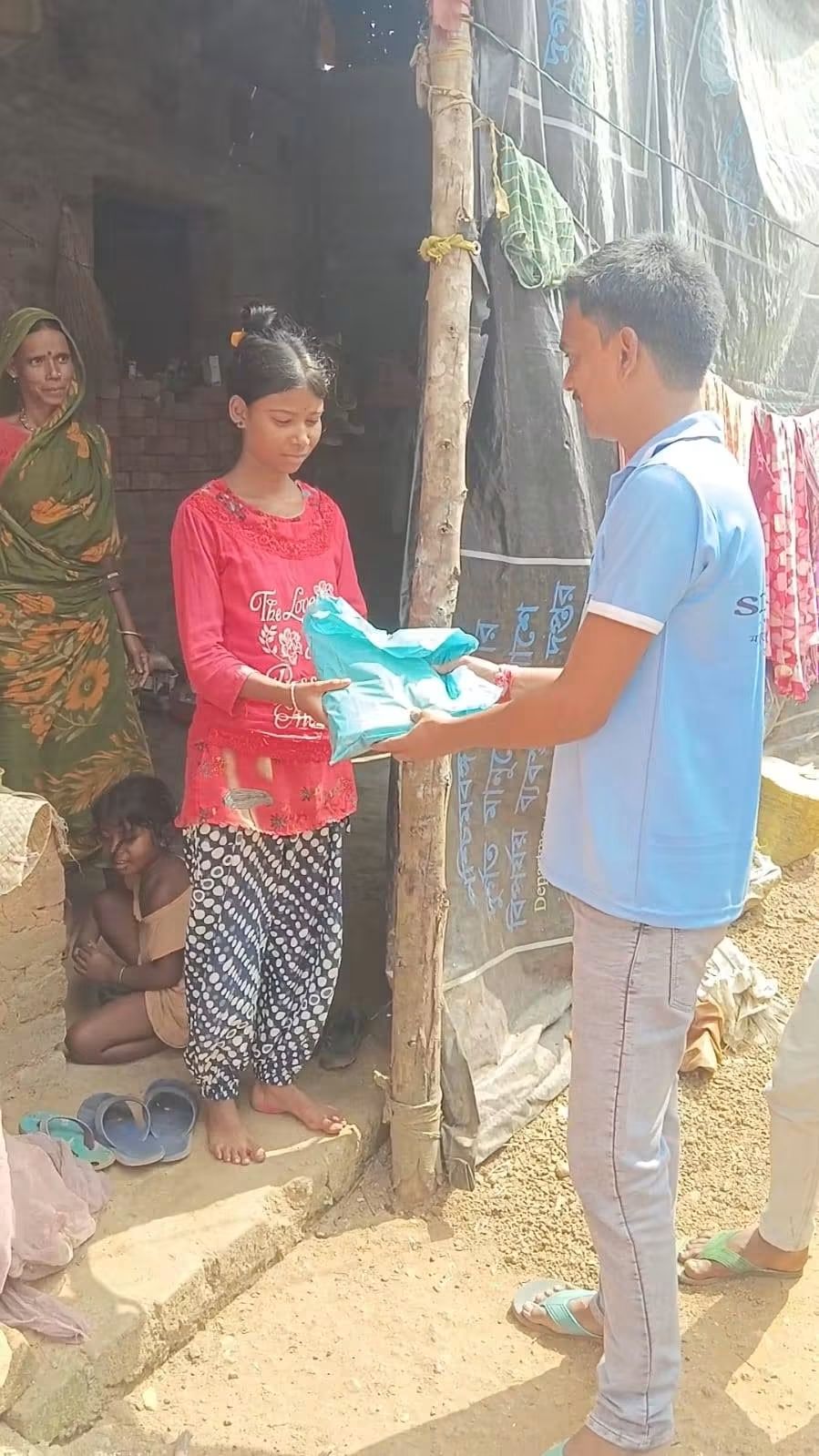 Smiling girl holding her gift in Laxmisagar